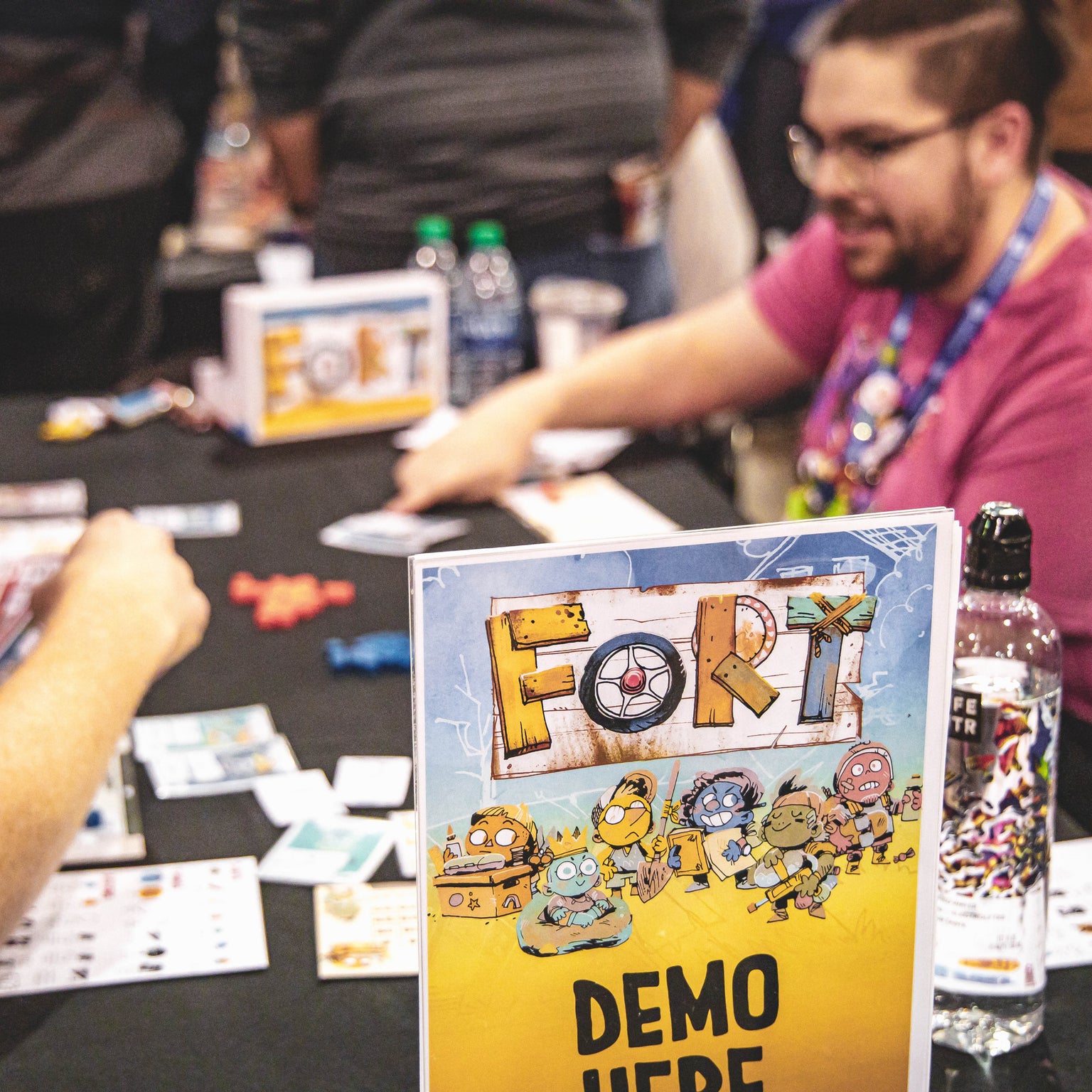 Leder Games employee demoing Fort at a convention