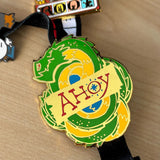 The Ahoy Leviathan pin displayed on a leder games lanyard