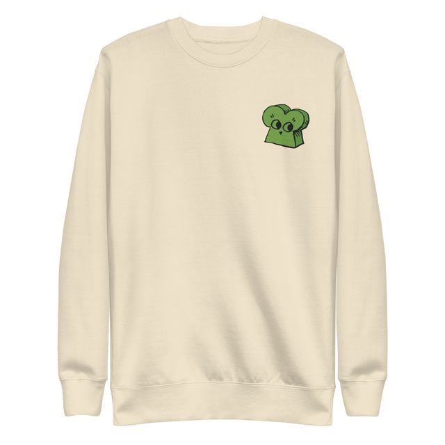 Cream crewneck sweatshirt with the Woodland Alliance meeple embroidered on the left chest. 
