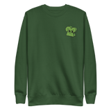 Green crewneck sweatshirt with the Woodland Alliance meeple embroidered on the left chest. 