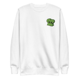 White crewneck sweatshirt with the Woodland Alliance meeple embroidered on the left chest. 