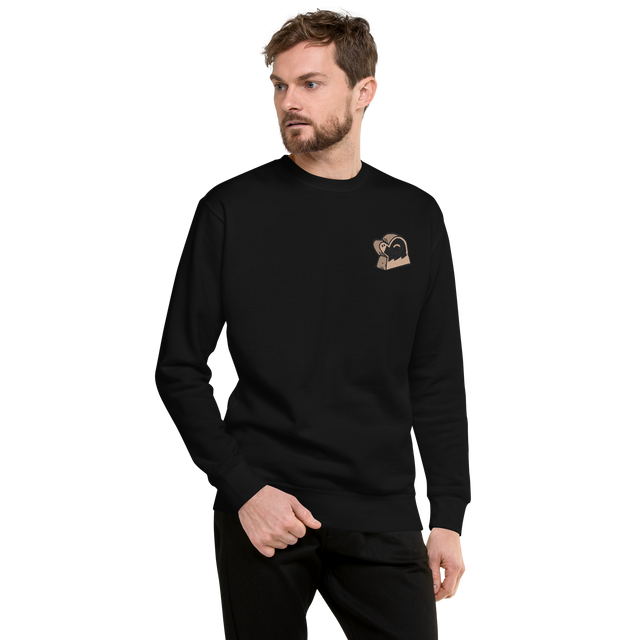 Model wearing a black crewneck sweatshirt with the Underground Duchy meeple embroidered on the left chestProduct mockup