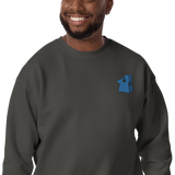 Model wearing a Grey crewneck sweatshirt with the Eyrie meeple embroidered on the left chest.