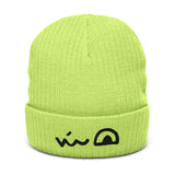 Bright (acid?) green beanie featuring the smirk of the Lizard Cult meeple embroidered on the folded brim.