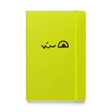 An acid green notebook featuring the smirk of the Lizard Cult meeple