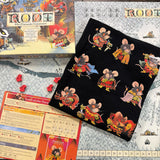 Moods tee in black folded on top of Root winter board with Marauder expansion box