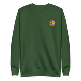 A green crewneck sweatshirt with the Chancellor Mask from Oath embroidered on the left chest.