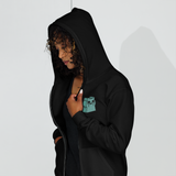 Model wearing Black Zip Hoodie with Riverfolk Otter meeple embroidered on left chest
