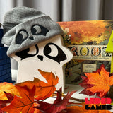 Oversized Root Vagabond meeple wearing Grey ribbed beanie with embroidered Raccoon eyes