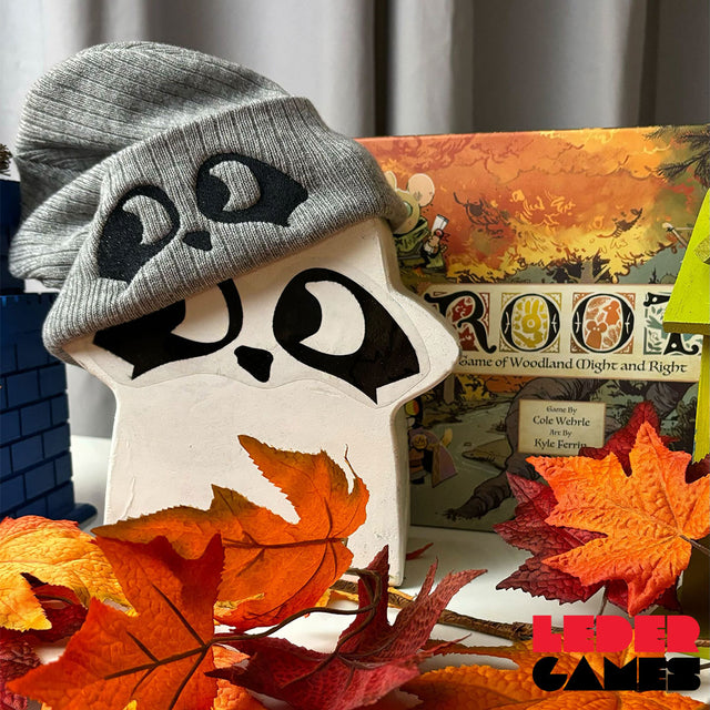 Oversized Root Vagabond meeple wearing Grey ribbed beanie with embroidered Raccoon eyes