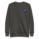 A slate crewneck with the Corvid Conspiracy meeple embroidered on the left chest.