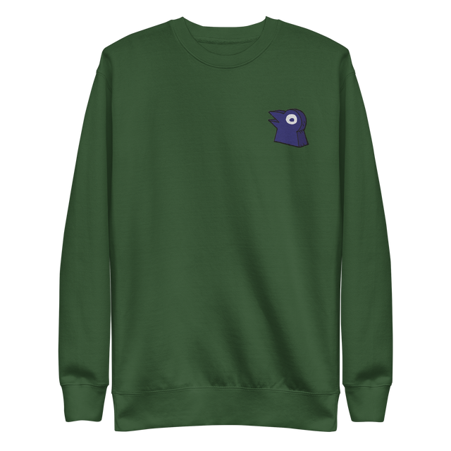 A green crewneck with the Corvid Conspiracy meeple embroidered on the left chest.