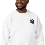 A model wearing a white crewneck with the Corvid Conspiracy meeple embroidered on the left chest.