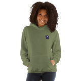 A model wearing an army green hoodie with the Corvid Conspiracy meeple embroidered on the left chest.