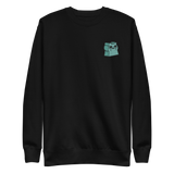 Black crewneck sweatshirt with the Riverfolk Otter meeple embroidered on the left chest. 