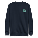 Navy crewneck sweatshirt with the Riverfolk Otter meeple embroidered on the left chest. 