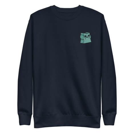 Navy crewneck sweatshirt with the Riverfolk Otter meeple embroidered on the left chest. 