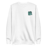 White crewneck sweatshirt with the Riverfolk Otter meeple embroidered on the left chest. 