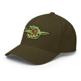 Grinning embroidered goblin from Vast on Olive baseball cap, three-quarter profile