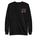A black crewneck sweatshirt with the Vast: The Mysterious Manor characters embroidered on the left chest.