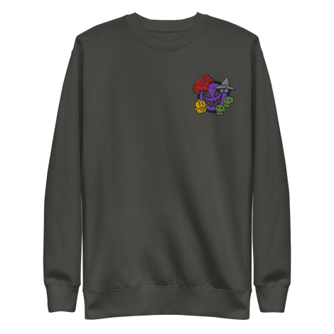 A dark grey crewneck sweatshirt with the Vast: The Mysterious Manor characters embroidered on the left chest.