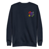 A navy crewneck sweatshirt with the Vast: The Mysterious Manor characters embroidered on the left chest.