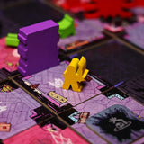 The yellow paladin wooden meeple in play on the Vast the Mysterious Manor board