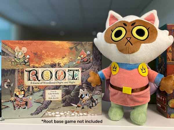 The plush version of Margot the Marquis de Cat leader, next to the Root game box