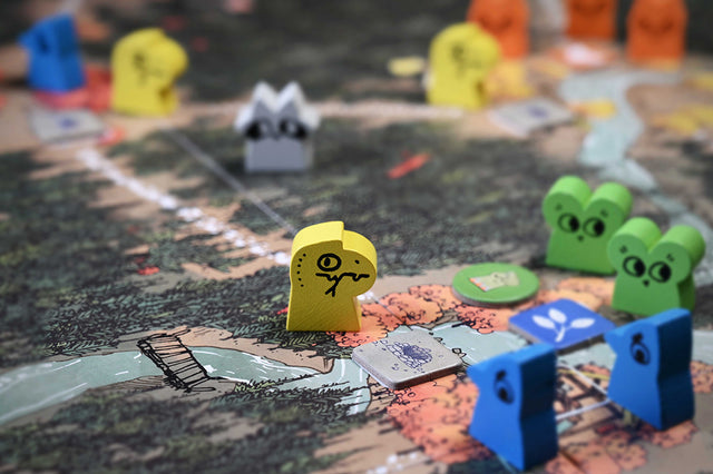 Warm Sun Prophet Hireling meeples in-play on the Root autumn game board